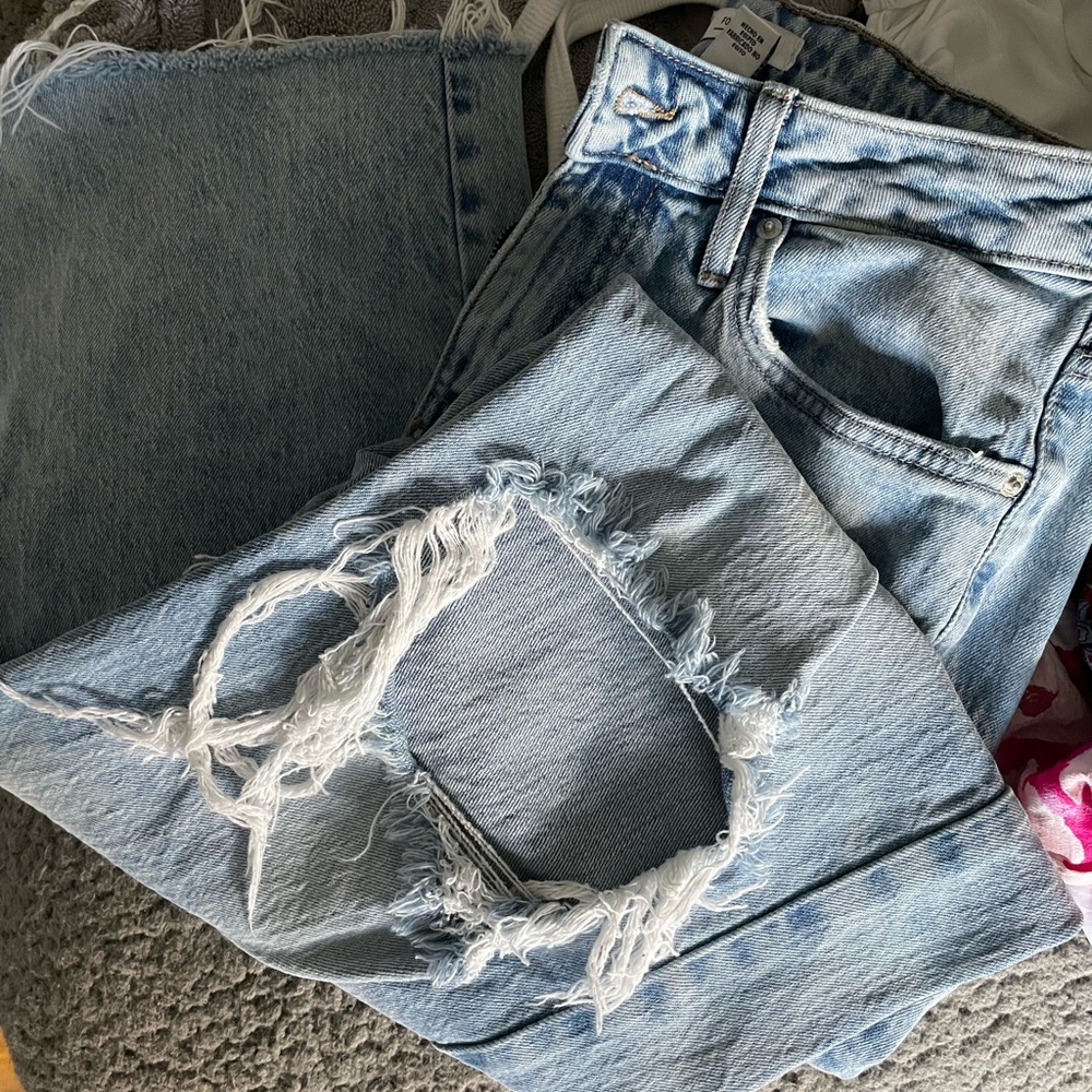 Destroyed mid- high rise light wash straight leg jeans
